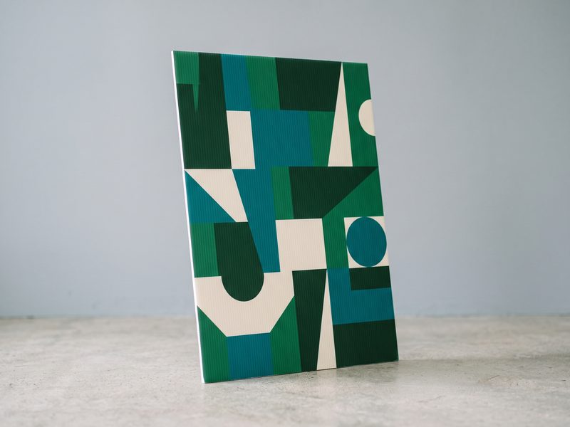 A Correx panel printed edge to edge in full colour, the flute lines showing beneath the ink.
